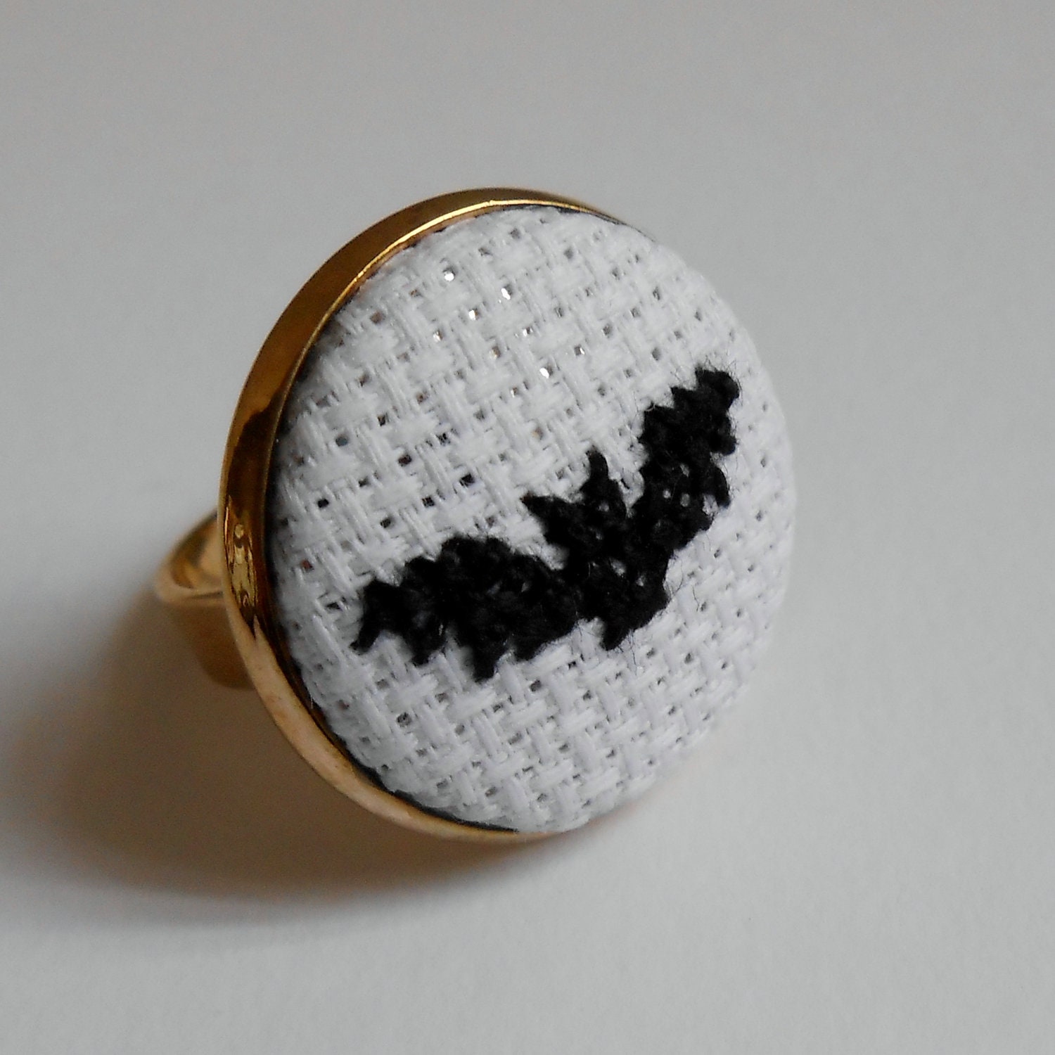 SALE BATMAN themed Bat Ring Hand Sewn in Cross Stitch Black on White set in a Gold Tone Ring