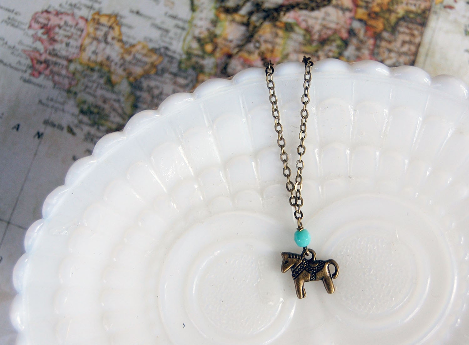 antique brass dala horse necklace with teal bead detail