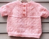 Baby girl, size 12/18 months, short raglan sleeve cable sweater, pink.