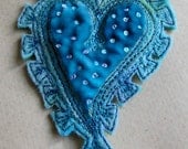 Pretty pastel blue spotty heart brooch