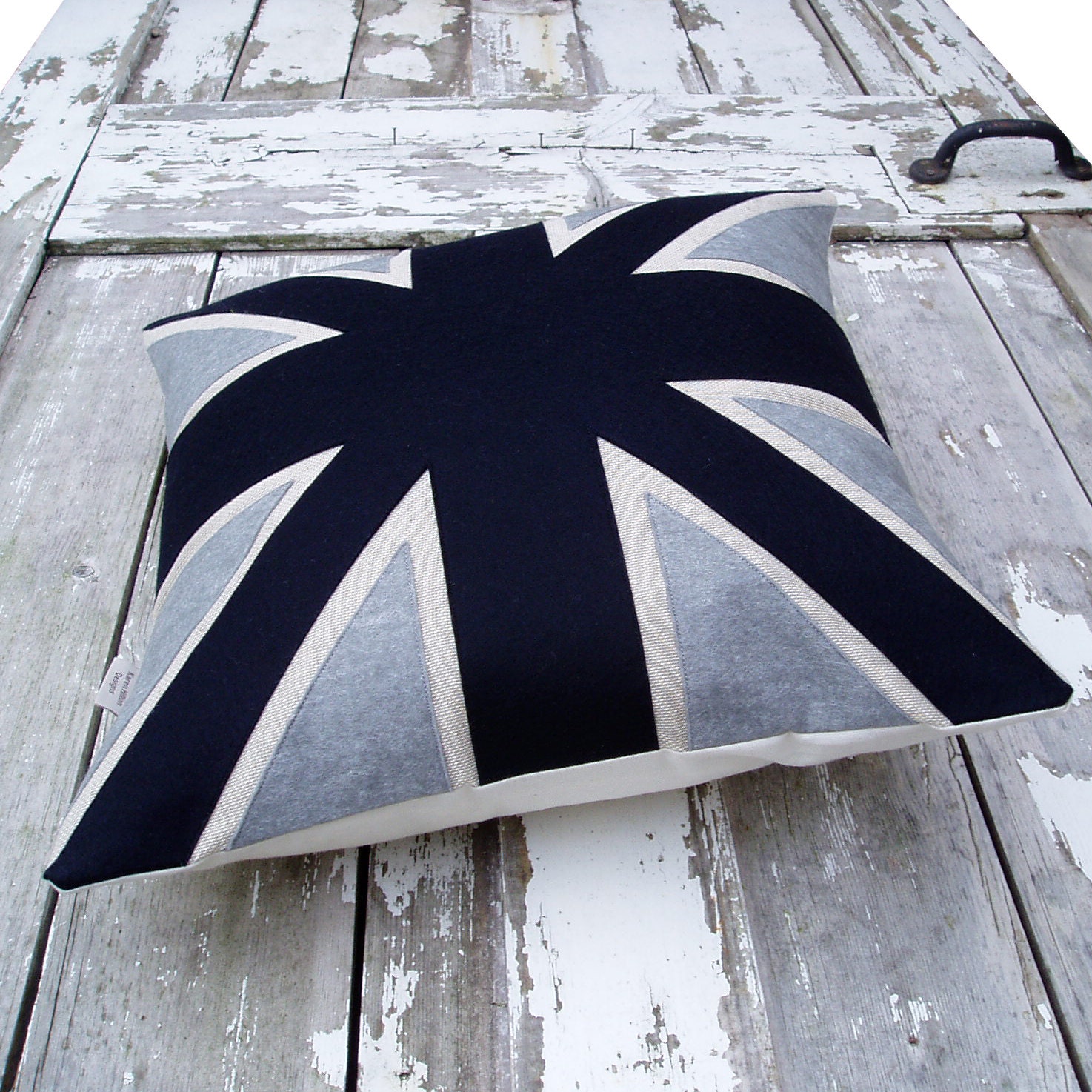 Black and grey Union Jack cushion/pillow in linen, cotton and appliqued wool felt fabrics.