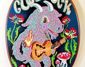 Good luck Nanny goat playing f-hole guitar in the garden