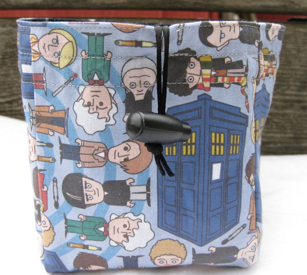 Dr Who doctors in blue and swirling black sky square bottom dice bag