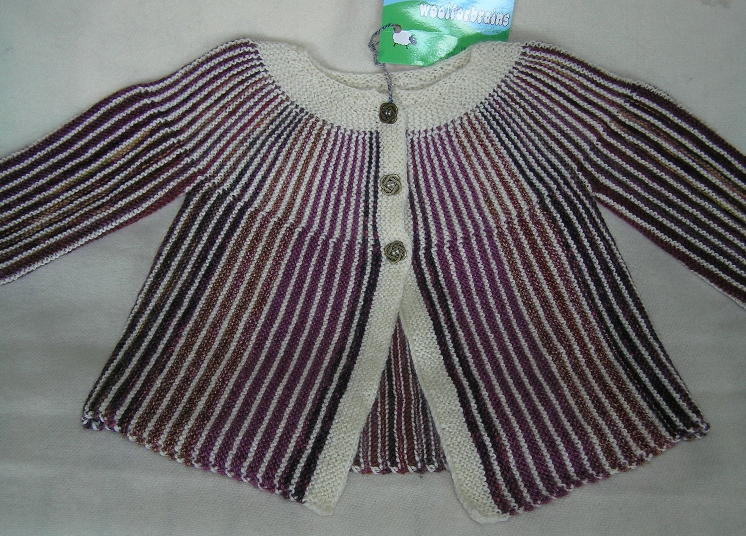Handknitted striped baby jacket