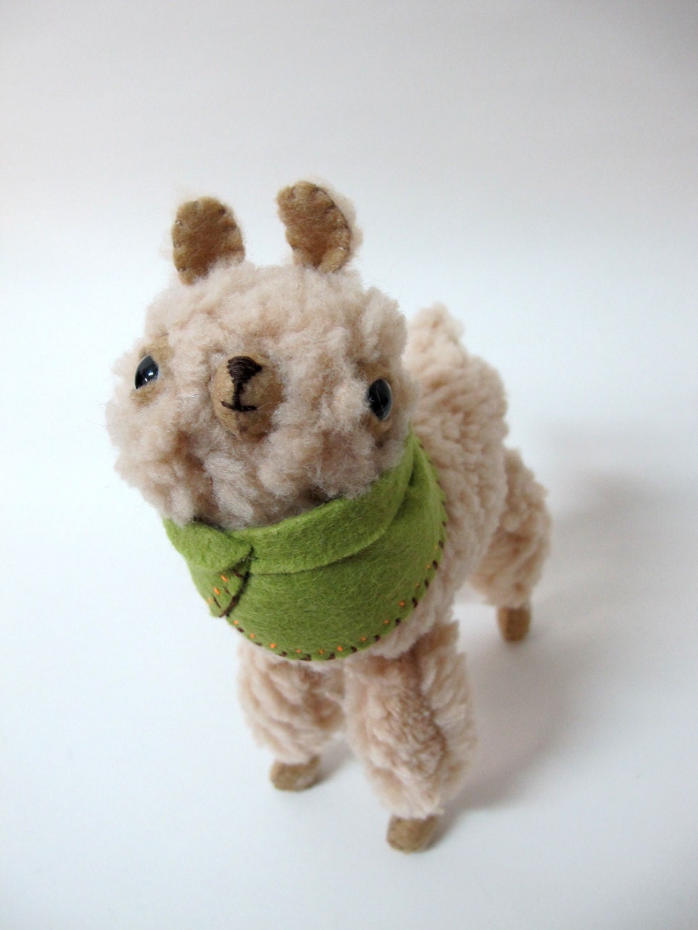 Small Wooly Alpaca in a Green Embroidered Cape