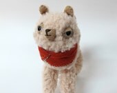 Small Wooly Alpaca in a Rust-Coloured Embroidered Cape
