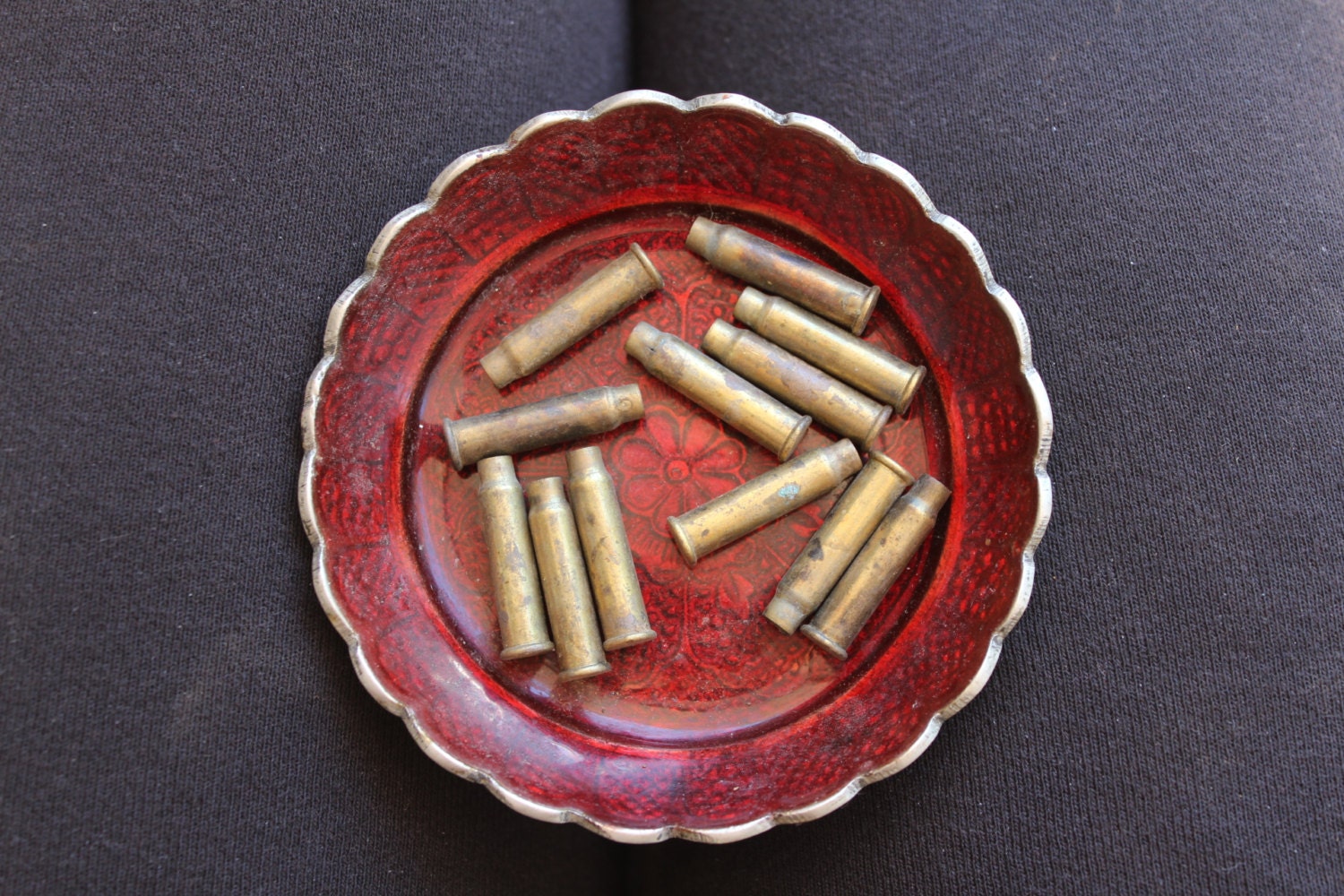 12 empty brass shell casings - 27x7mm