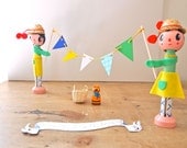 Cake topper table centrepiece mid century style peg dolls holding mini banner celebration