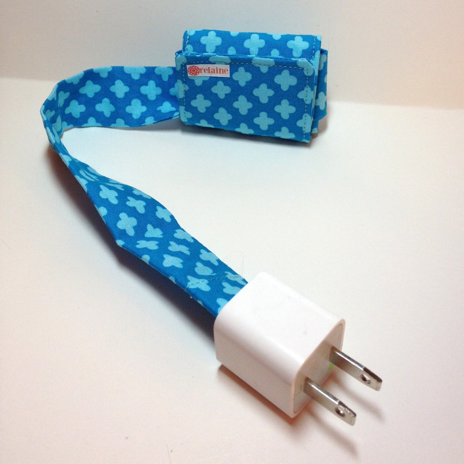 Blue PowerTube.  Charging cord organizer for iPhone or iPod.  Cord keeper.  Cord organizer.  Power cord case.