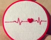 Heartbeat felted embroidery wall art