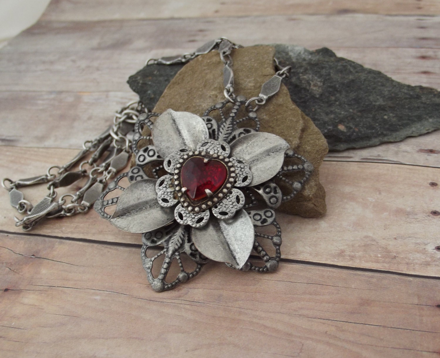 Antiqued Silver Flower Necklace Featuring Red Crystal Heart