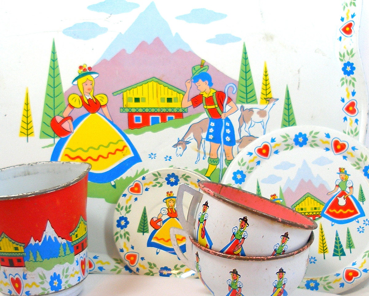 60's Tin Toy Tea Set, Swiss Miss, 8 pieces with cups, pitcher, tray & plates.