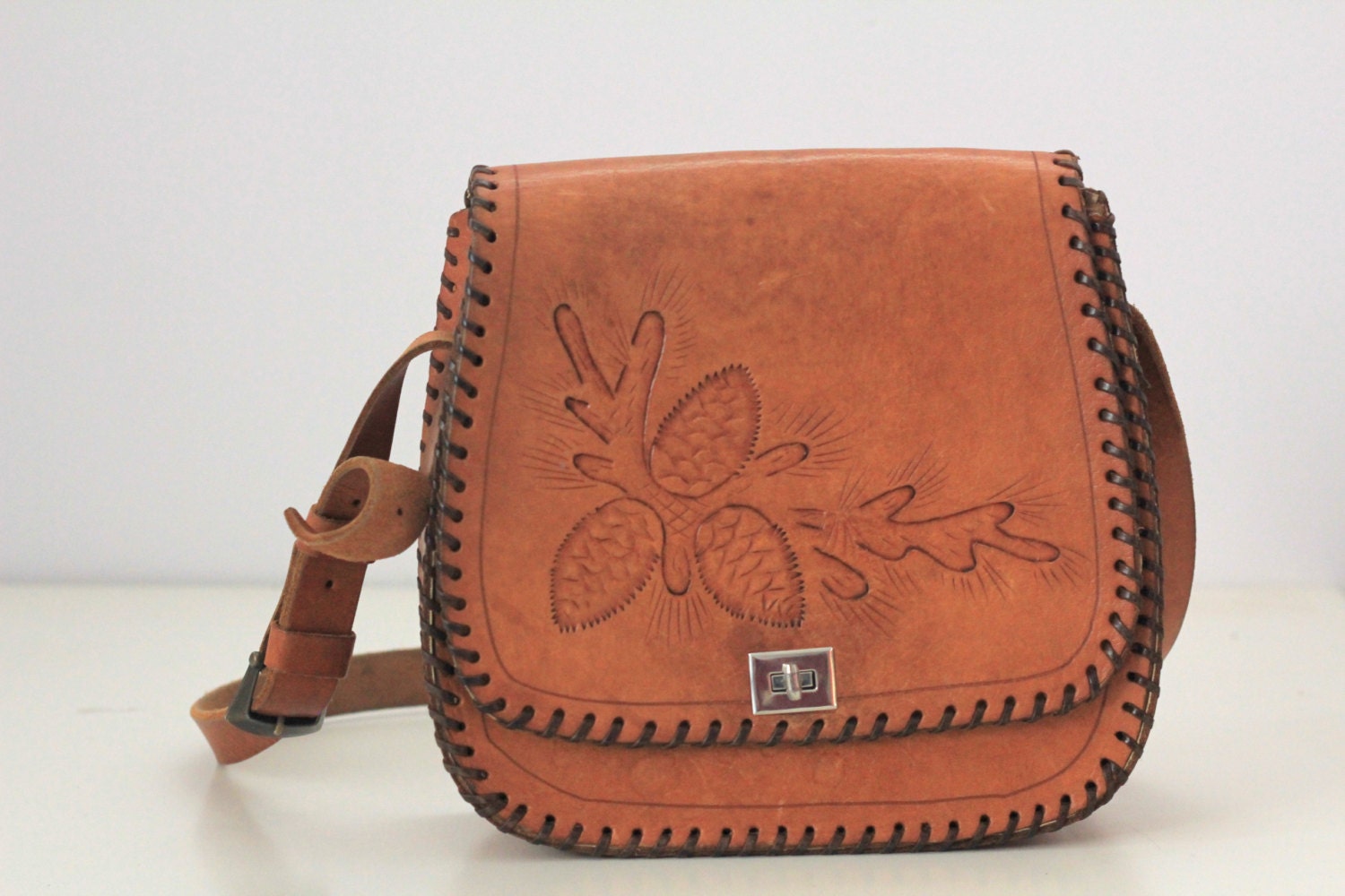 Danita bag. Vintage 1970s tooled leather handbag with forest pine cones.
