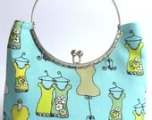 Clutch purse - silver metal frame, pale turquoise mannequin print
