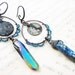 Harmonies. Iridescent Rustic assemblage earrings with coins and rainbow titanium crystal points.