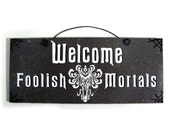 Welcome Foolish Mortals sign. Haunted Mansion.