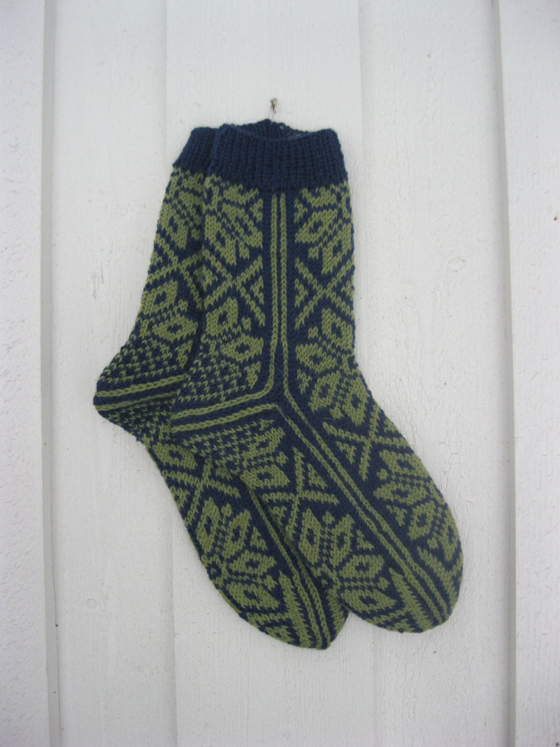 Handknitted norwegian socks in blue and green
