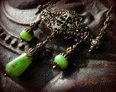 Vintage inspired necklace with green glass drops and filigree