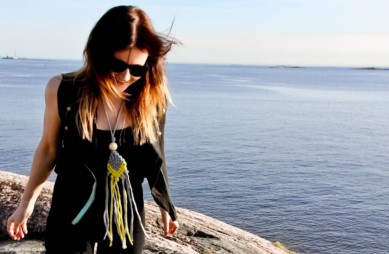 Adjustable macramee statement necklace with long fringes and a wooden bead