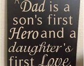 Hand painted wood sign with vinyl lettering A dad is a son's first hero and a daughters first love.