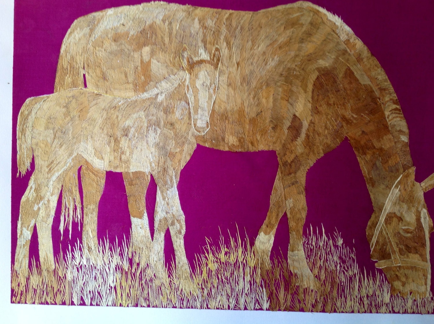 Horse and colt in rice straw art.  Handmade leaf art.  No color, paint or dye added to the natural color of rice straw