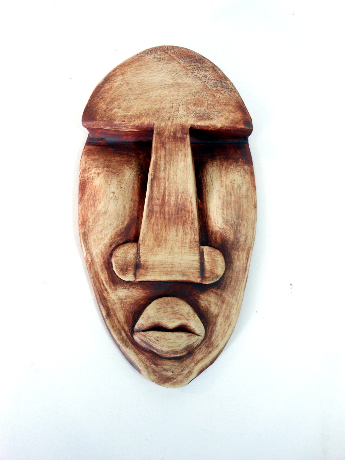 A distant Relative stoneware hiding mask