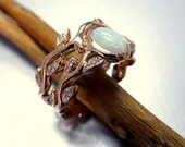Engagement ring with opal and diamonds.  Leaf engagement ring set