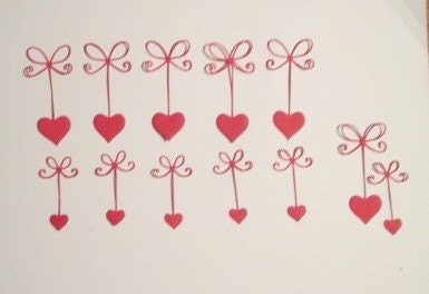 Die cut Red Hearts hanging on delicate bow 12 pcs.