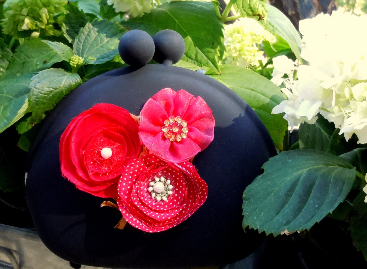 Black clutch handbag with red poppies