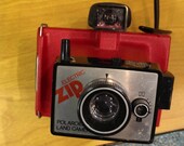 Vintage camera. Red Polaroid Electric Zip Land Camera.