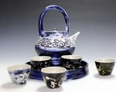 Porcelain and ceramic pottery tea set with five unique tea bowls
