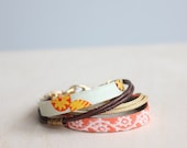 Zaveri bracelet in coral - Cotton, silk and leather bracelet with gold, orange and coral