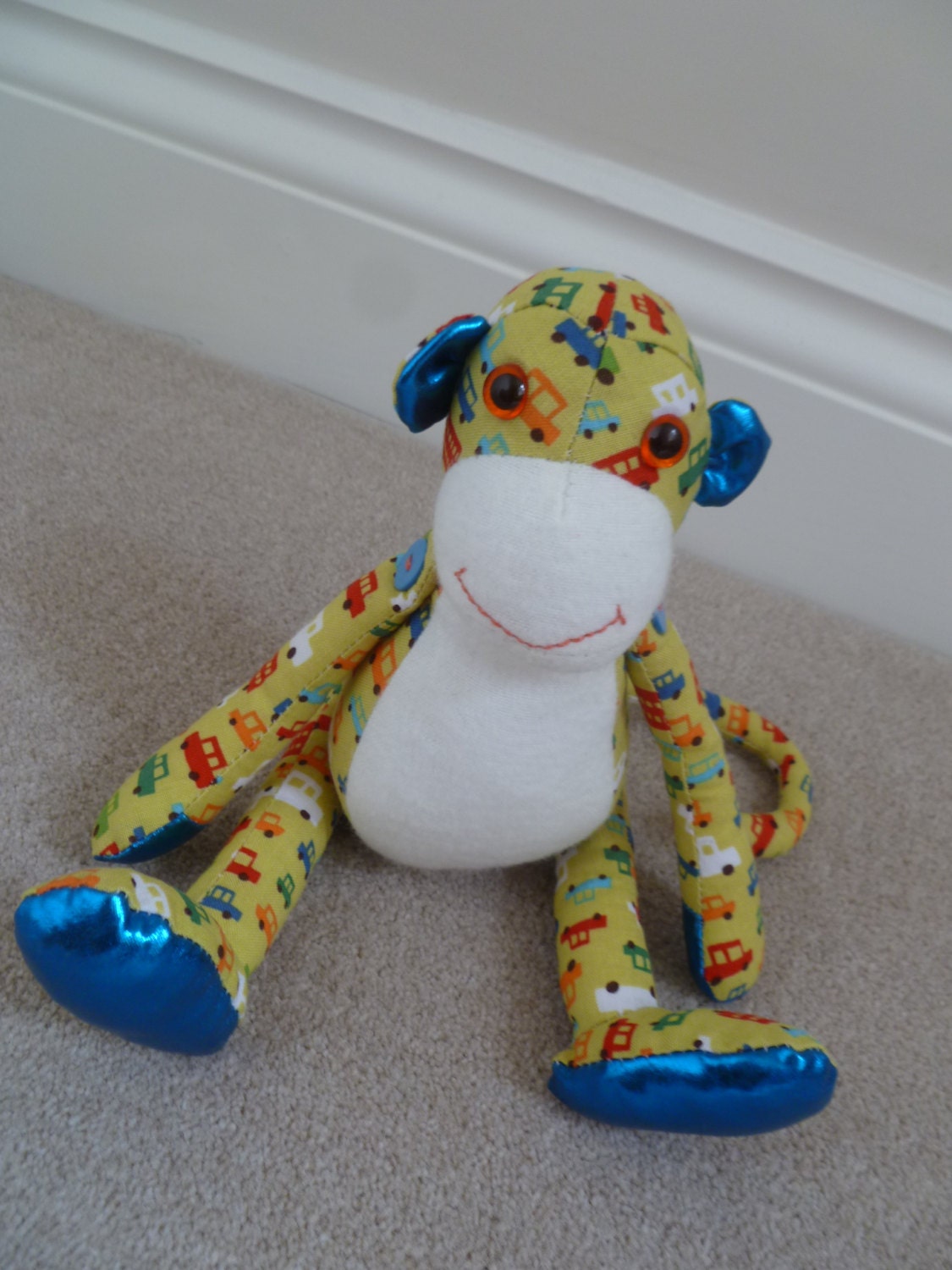 Green and blue fabric monkey soft toy