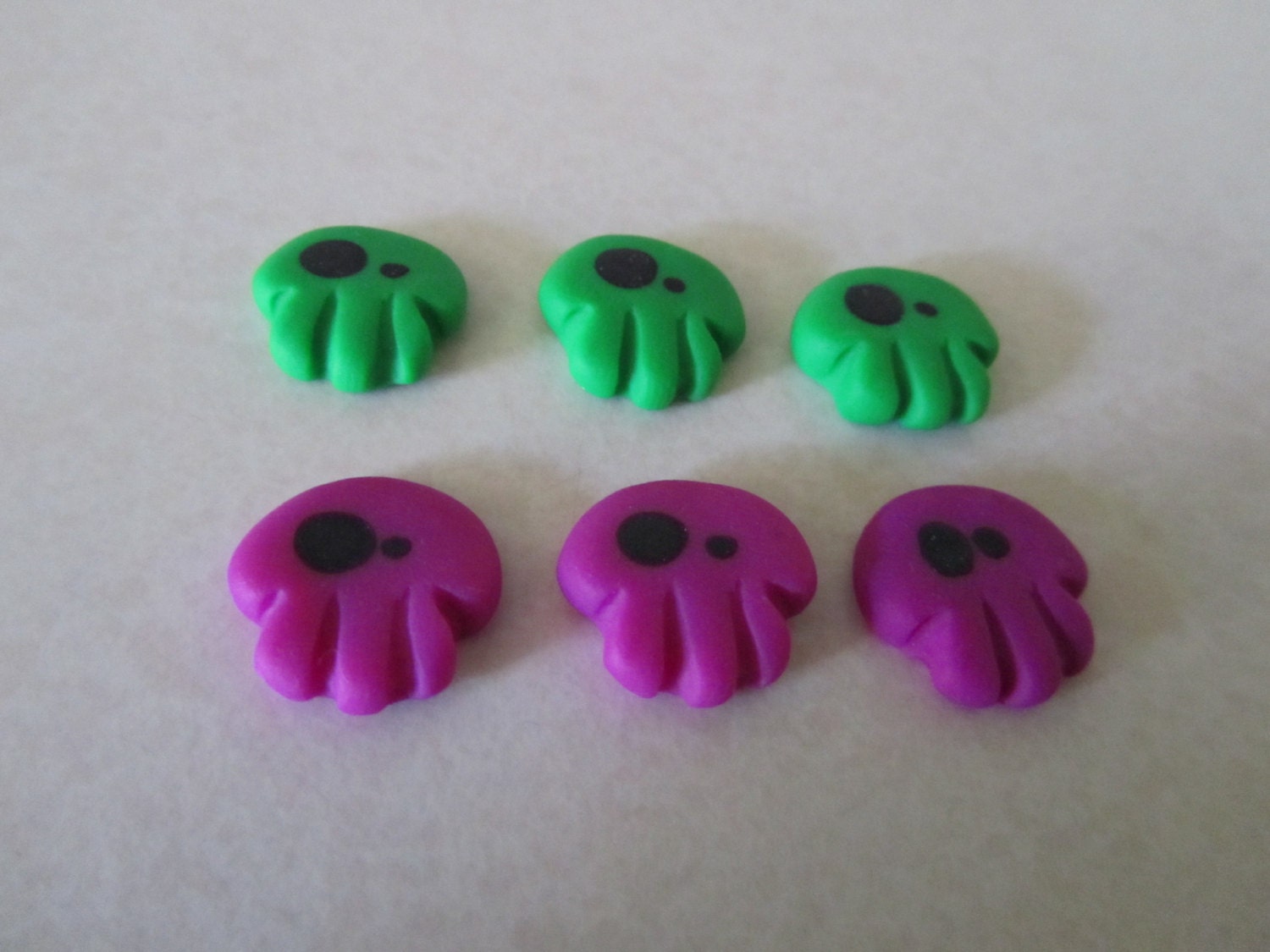 Creepy Cute Wonky Eyed Skulls magenta green mix