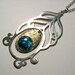 Peacock feather necklace in brass and paua with silver fill