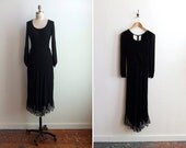Vintage 1970s black viscose maxi dress with scalloped lace hem