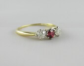 Three Stone Engagement Ring. Old Cut Diamonds and Garnet, Circa Early 1900s.