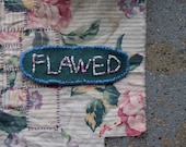 Beaded Flawed Badge