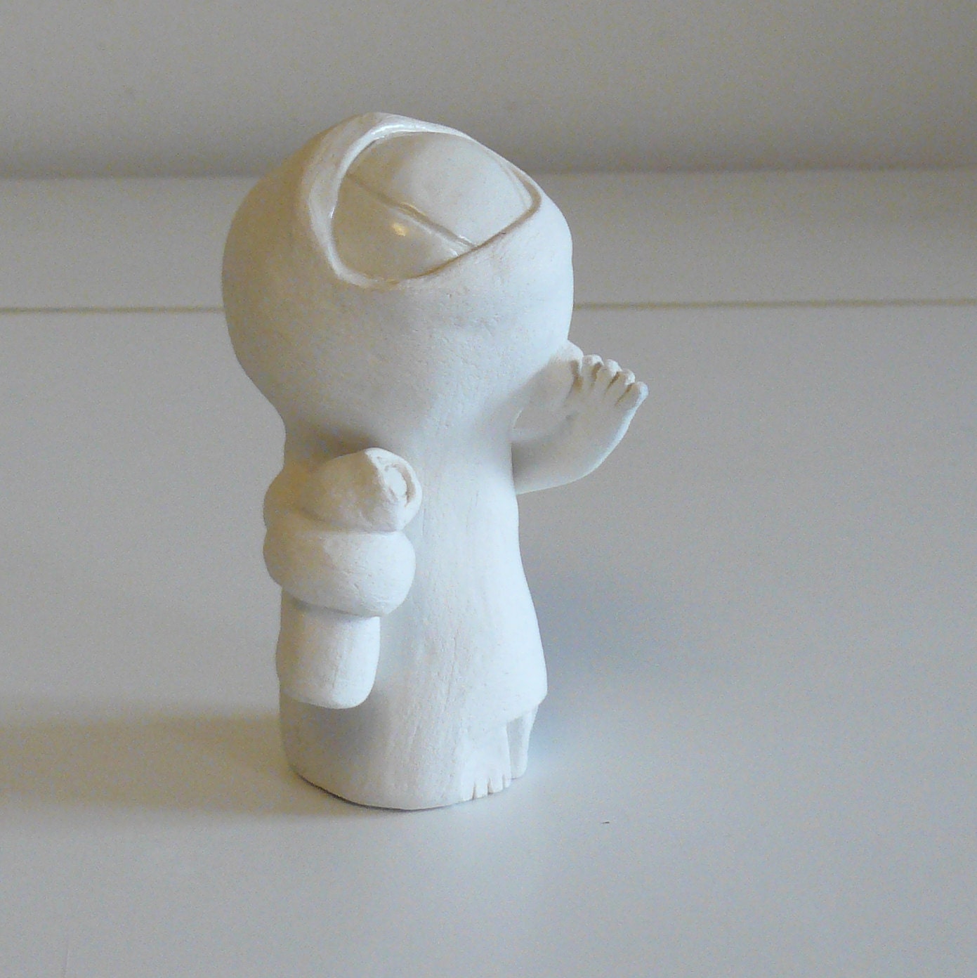 Claytoo: pottery critter. Little white stoneware alien would like to go home with you.