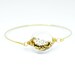 Golden glitter in small flat round hand blown glass gold tone cuff