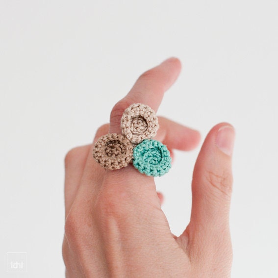 Ring crocheted circles. Beige tones and turquoise.