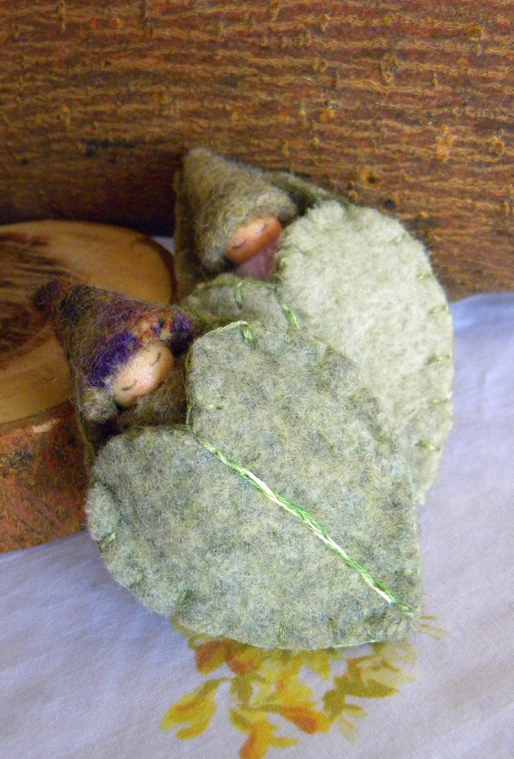 Sleeping Baby in green leaf Pouch, Spring Toy, Waldorf Gnome Baby, Leaf/ Heart, Upcycled eco toy, sage green, patterned wool
