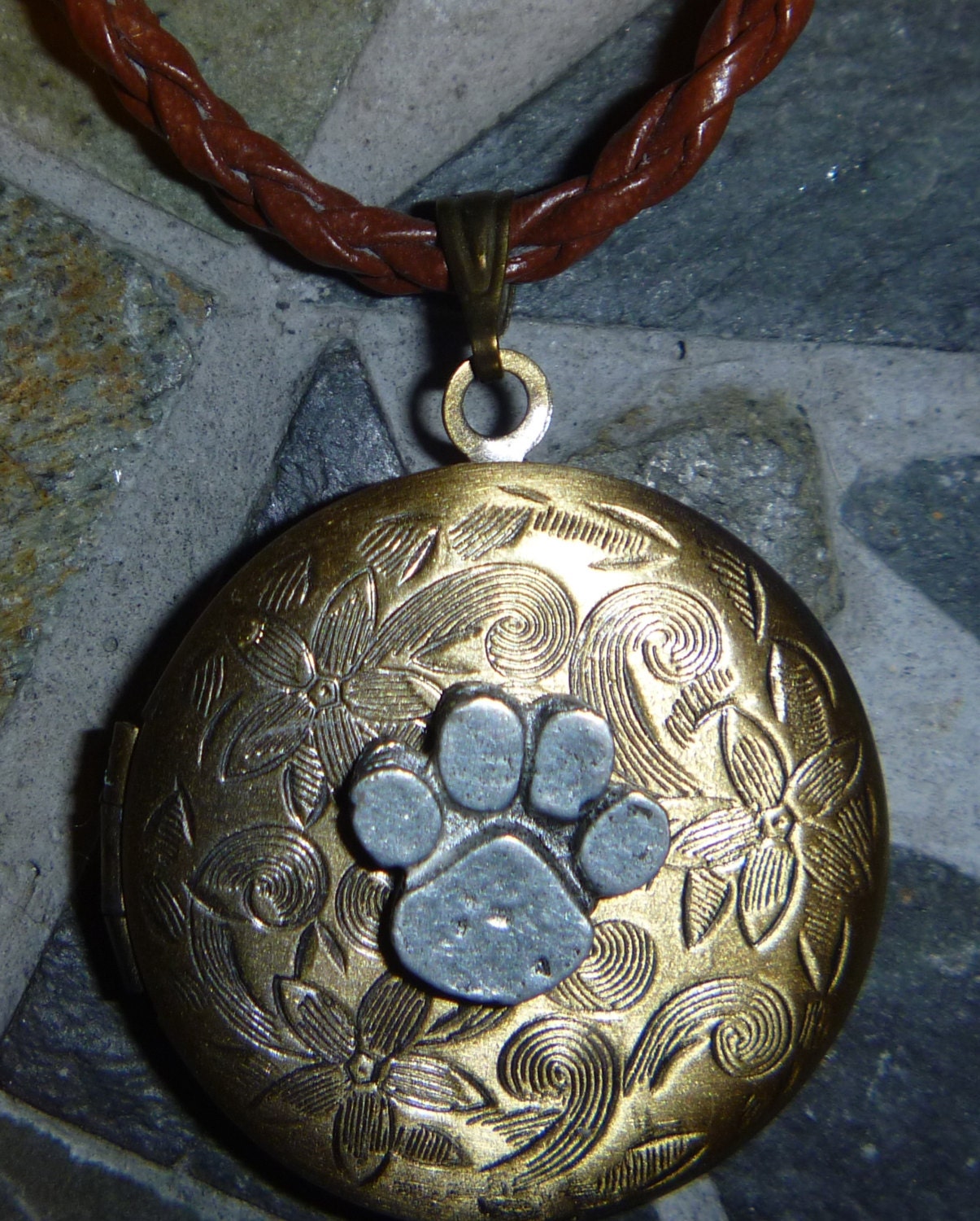 Paw print round floral locket with brown cord
