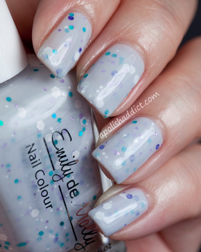 Nail polish - "Harmony" white, turquoise, and purple glitter in a light grey base
