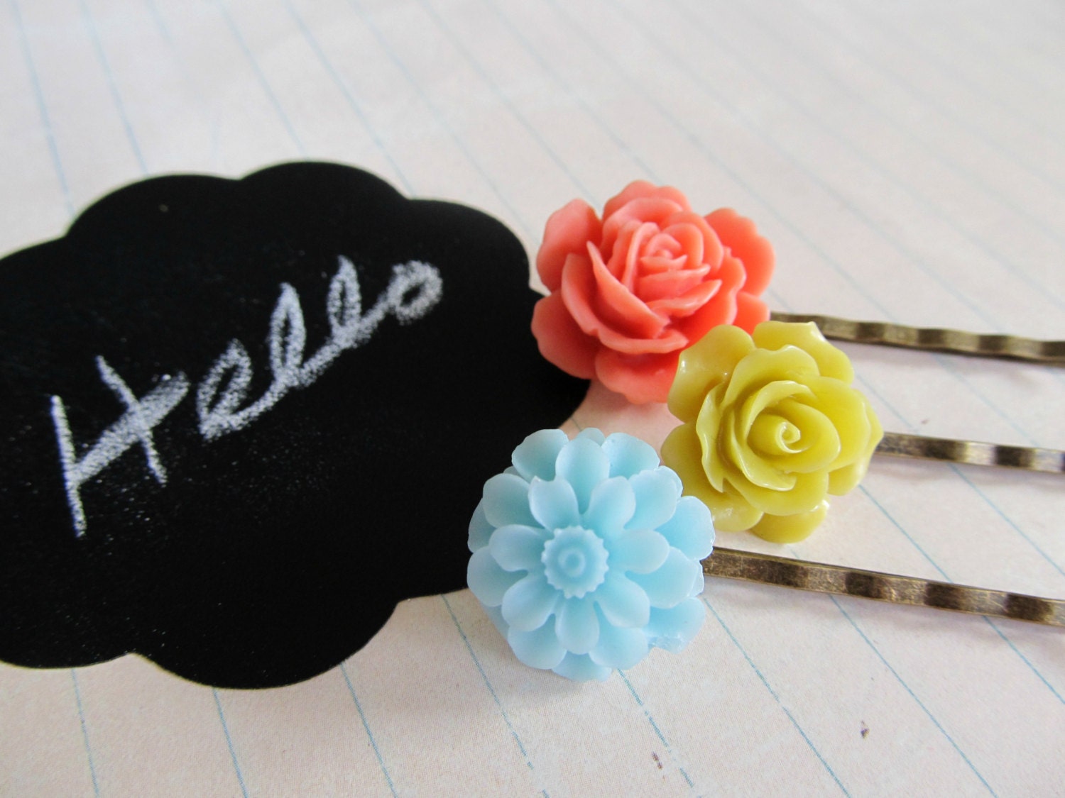 Three botantical hair pins in coral peach, chartreuse lime and baby blue