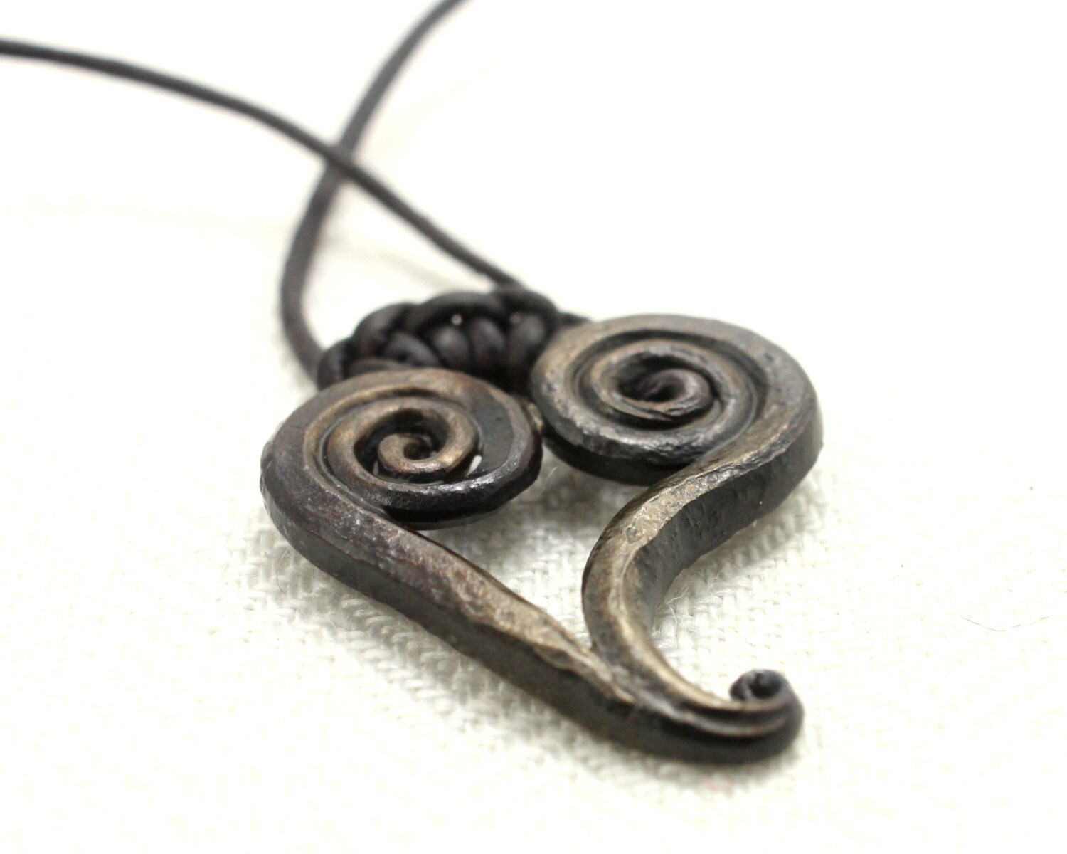 Iron Heart Necklace a hand pendant on a leather by Taitaya