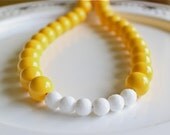 Yellow and white statement necklace color block