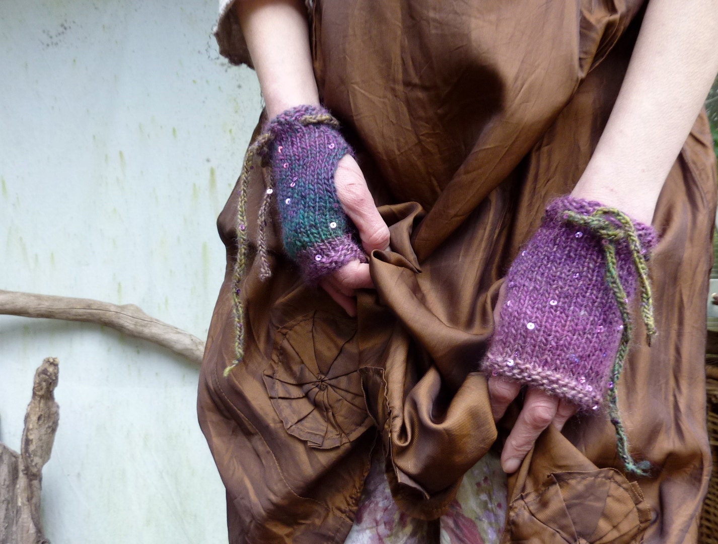 Elven Cuffs, soft, hand knitted fingerless gloves with in green and purple variated yarn and tiny sequins READY TO SHIP