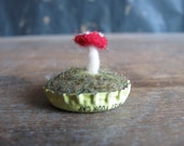 Felted amanita mushroom in a pastel yellow bottlecap