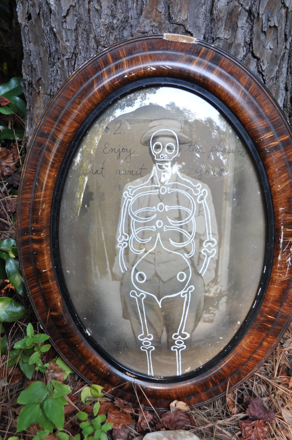 Oval Beveled Grass Framed Man Painting